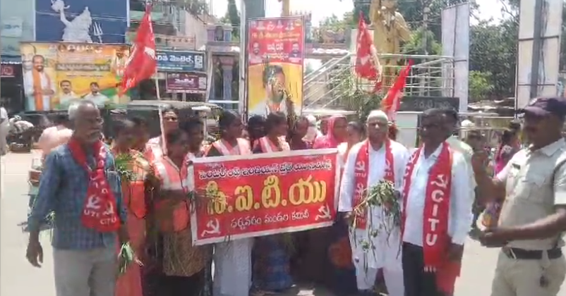 Sanitation workers at Dharmawaram School demand immediate payment of pending wages and better working conditions during a unique protest.