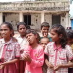 Students at the government primary school in Gosaam Palle express concerns over a teacher's behavior and lack of proper education, leading to protests.