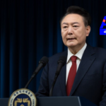 South Korean President Yoon Suk Yeol faces impeachment and arrest warrant amidst investigations over emergency law and parliamentary motion approval.