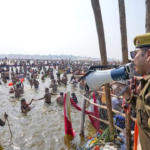 UP Police register cases on social media accounts for posting videos of women at Kumbh Mela. Investigation underway.