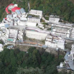 A woman entered Vaishno Devi temple with a gun, exposing a security lapse. Police detained her, raising concerns among devotees.