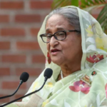 Hasina lashes out at Yunus for erasing war heroes’ legacy, assures people of her return amidst political unrest in Bangladesh.