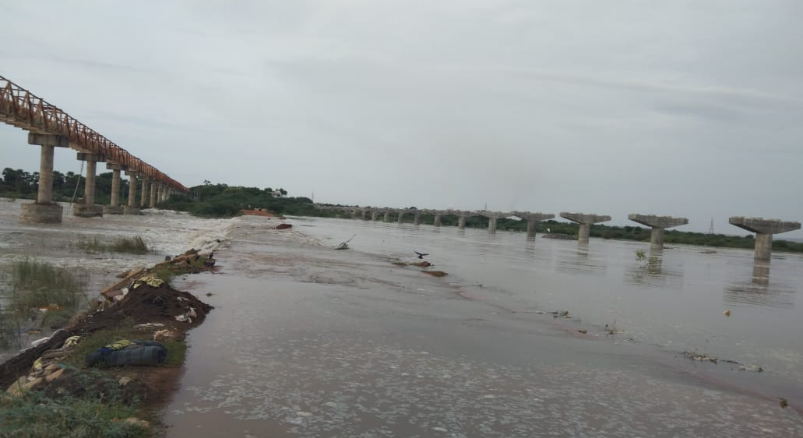 Heavy rains in Kadapa district have filled reservoirs, leading to water release from Mylavaram, flooding the Pennar River and affecting local transportation.
