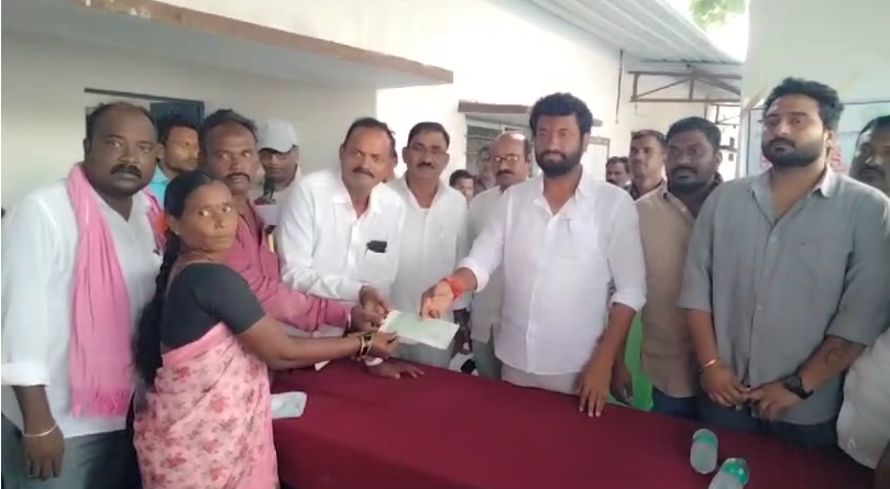 MLA Anil Jadhav attended a cheque distribution program in Thalamadugu, handing out a total of ₹15,01,740 to beneficiaries. He urged the government to fulfill its promises without deception.