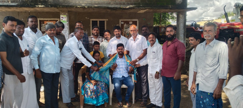 Pagidi Pal Bhaskar, a DSC school assistant from Kannayapalli, was honored by village elders and youth for his achievement in Biological Sciences, inspiring future generations.