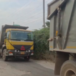 Overloaded trucks on Navigate road pose severe threats; recent accident sparks public outrage, urging officials to regulate unsafe transportation practices.