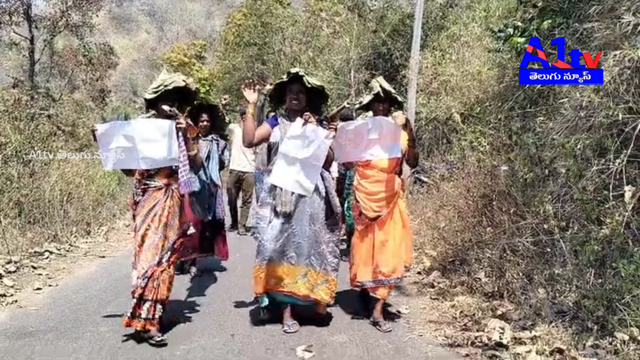 PVTG tribal women carried out a 4 km doli march demanding roads, clean water, and healthcare at Bangaru Bandar Road.