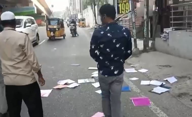 students throwing books out of college window during flying squad check