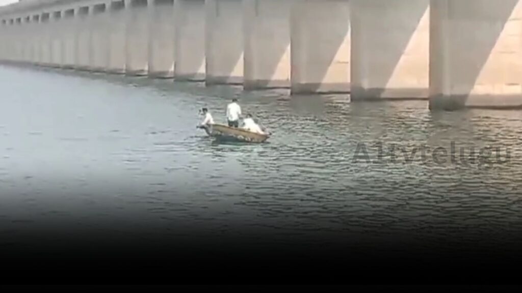 Professional swimmers rescuing a man who jumped into the Krishna River at Beechupally