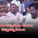 Revanth Reddy and Chandrababu Naidu sharing a friendly moment at Ramoji Excellence Awards