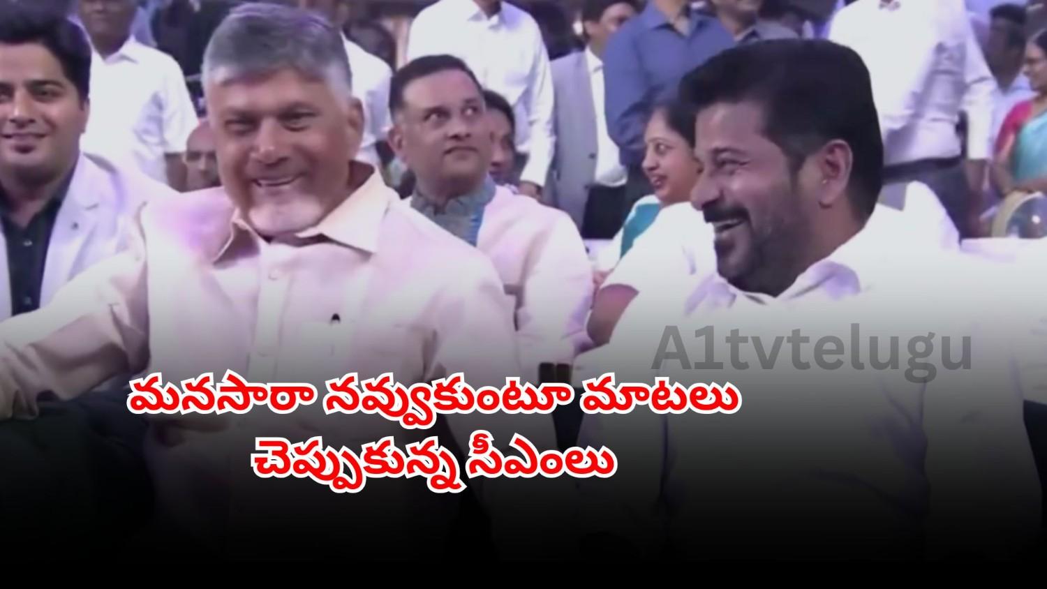 Revanth Reddy and Chandrababu Naidu sharing a friendly moment at Ramoji Excellence Awards
