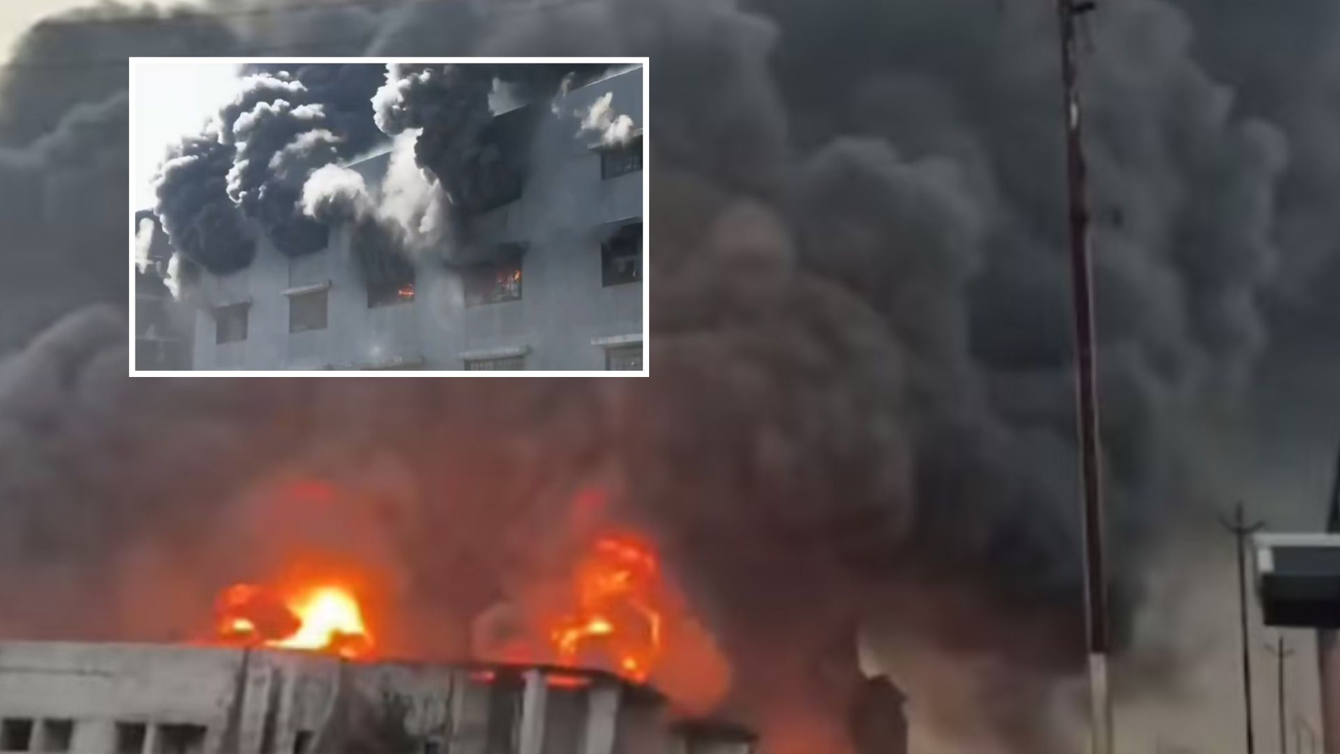 Fire personnel working to control the blaze at the seven-storey textile building in Surat