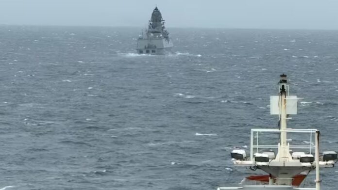 indian navy warships escorting oil tankers through hormuz strait during middle east tensions