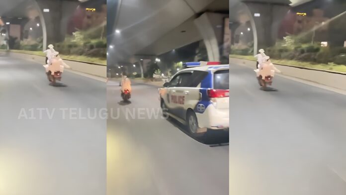 dangerous bike wheelie stunts by youths in attapur before police intervention