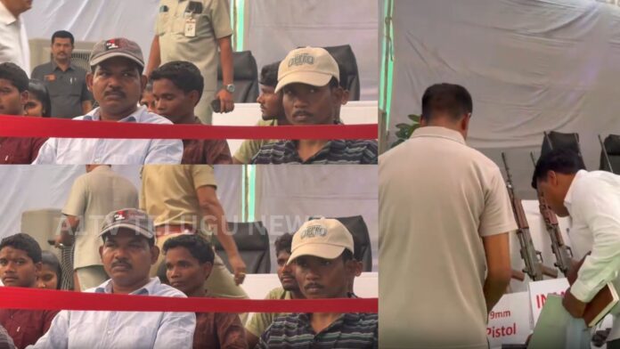 Maoists surrendering before Telangana DGP with weapons as part of rehabilitation program
