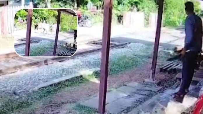 railway gate keeper santhip saves man from suicide attempt near train tracks