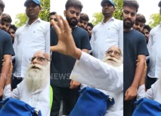 Elderly man speaking during a public protest with people listening