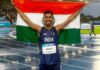 Indian athlete Gulveer Singh celebrates after winning silver in the Commonwealth Games 10000m race
