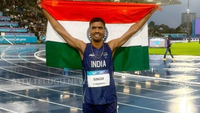 Indian athlete Gulveer Singh celebrates after winning silver in the Commonwealth Games 10000m race