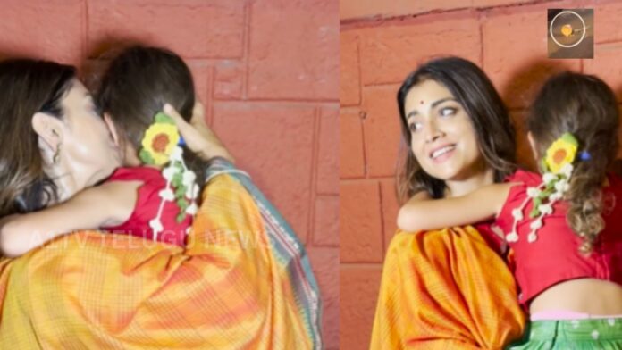 Shriya Saran comforting a child after an emotional moment