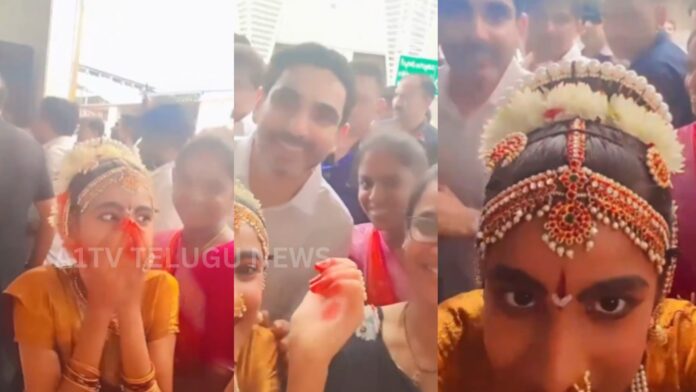 Nara Lokesh posing for a selfie with a young girl at Mangalagiri Railway Station
