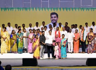 Minister Nara Lokesh distributing house pattas to beneficiaries in Mangalagiri