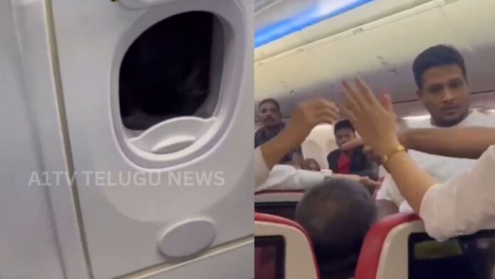 Passenger attempts to open Batik Air emergency exit door during Kuala Lumpur to Kochi flight.